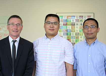 From left, Andrew P. McMahon, director of the Eli and Edythe Broad Center for Regenerative Medicine and Stem Cell Research, with Yong Chen’s son Gary and researcher Qi-Long Ying (Photo by Cristy Lytal)