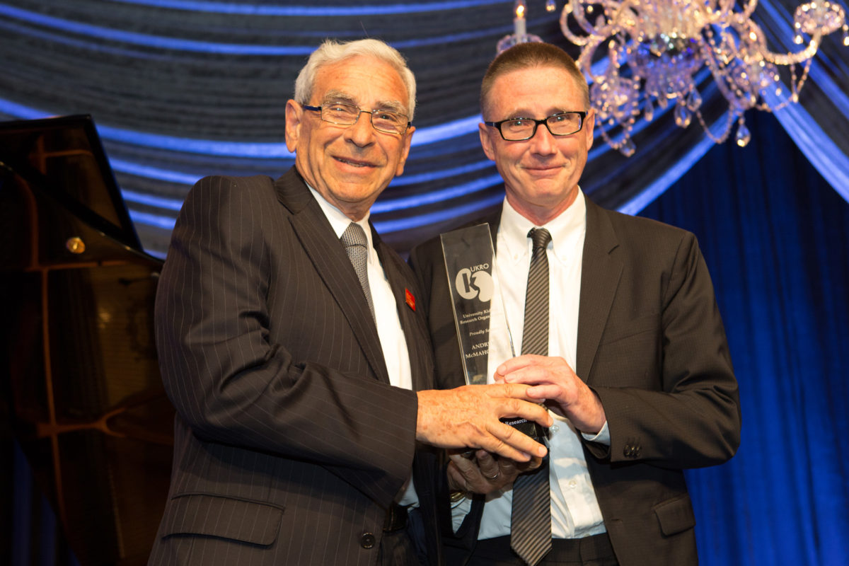 From left, Edward Crandall, chair of the Department of Medicine, presents a UKRO award to Andy McMahon, chair of the Department of Stem Cell Biology and Regenerative Medicine. (Photo courtesy of HSC Communications office)