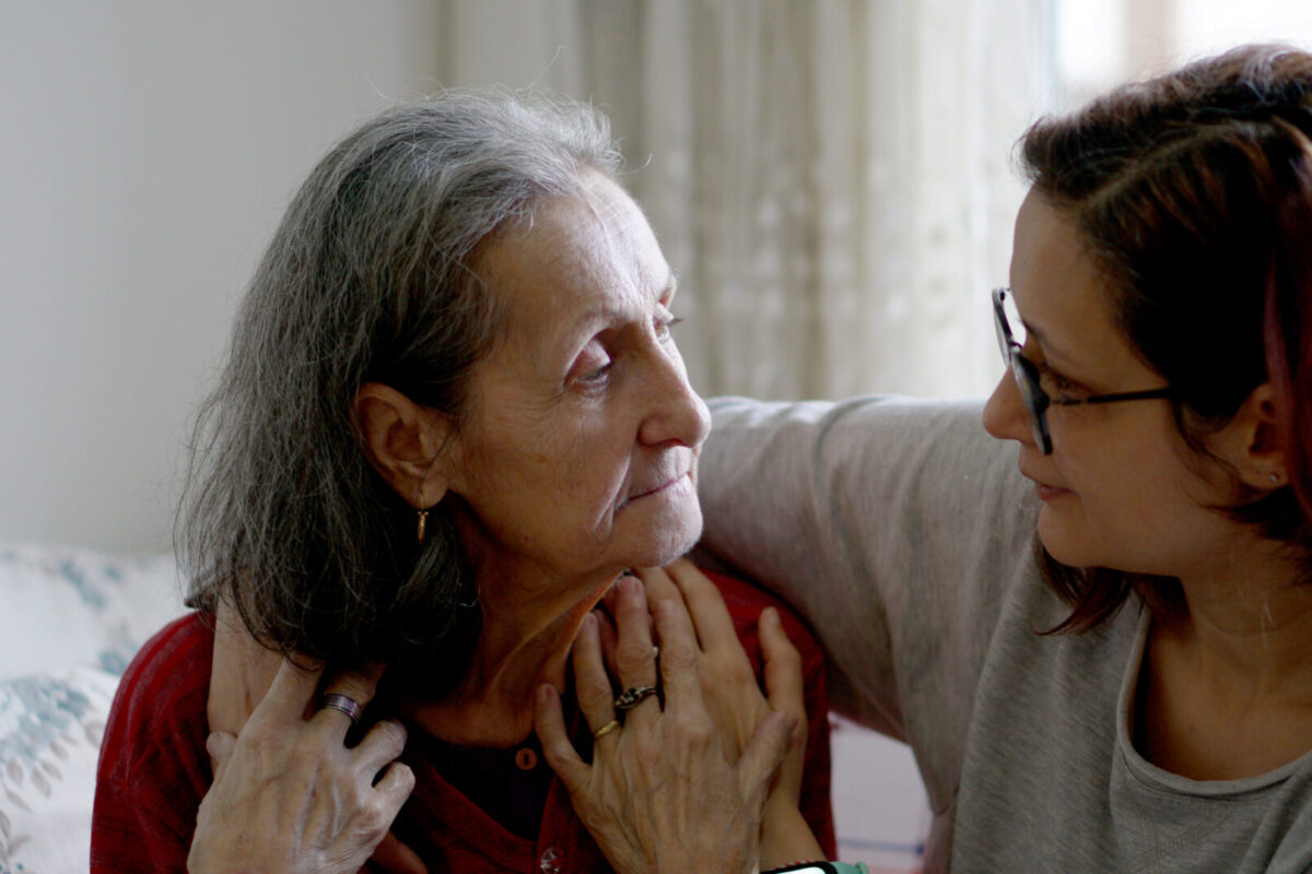 Caregiver with older woman (Image courtesy of iStock)